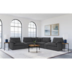 Modular Power Reclining Sectional in Dark Grey Fabric.