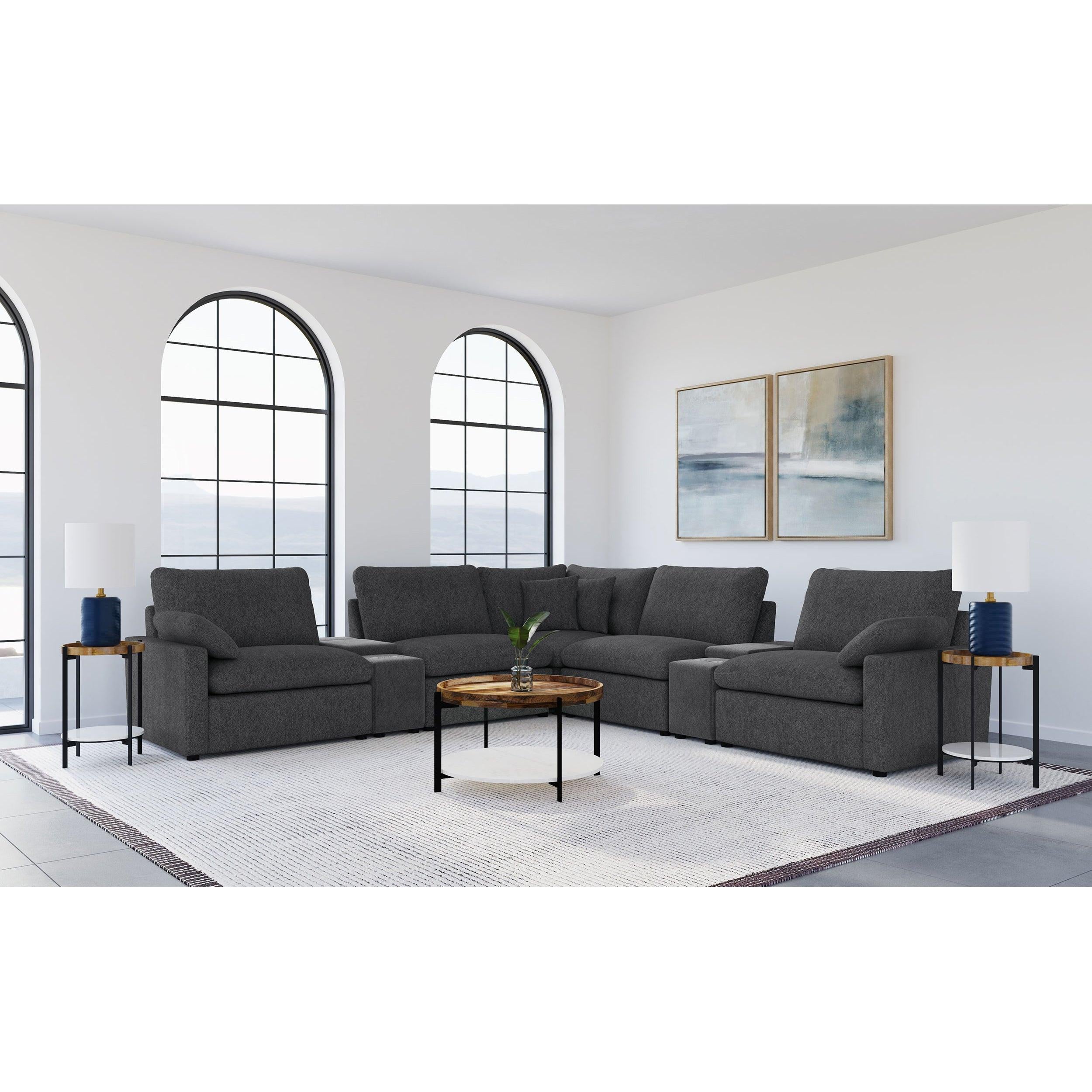 Modular Power Reclining Sectional in Dark Grey Fabric.