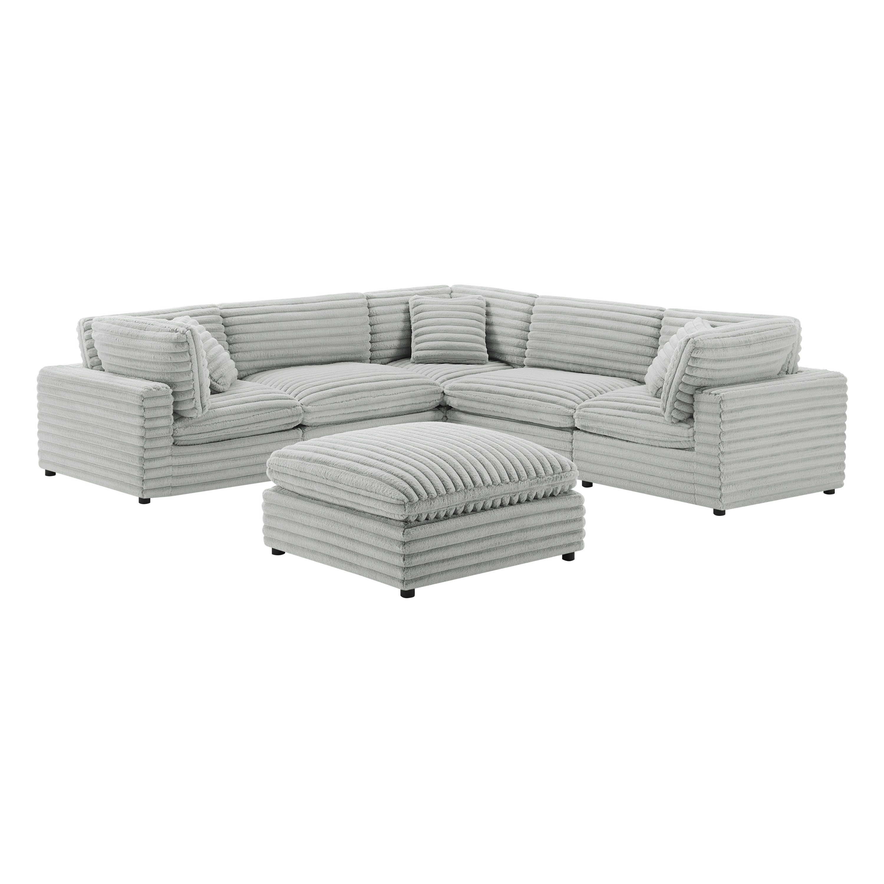 Six-piece modular sectional in plush gray corduroy-style polyester with a matching ottoman, isolated on white.