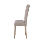 Side profile of Modern Beige Dining Chair featuring plush seat and angled rubberwood legs for ergonomic comfort.