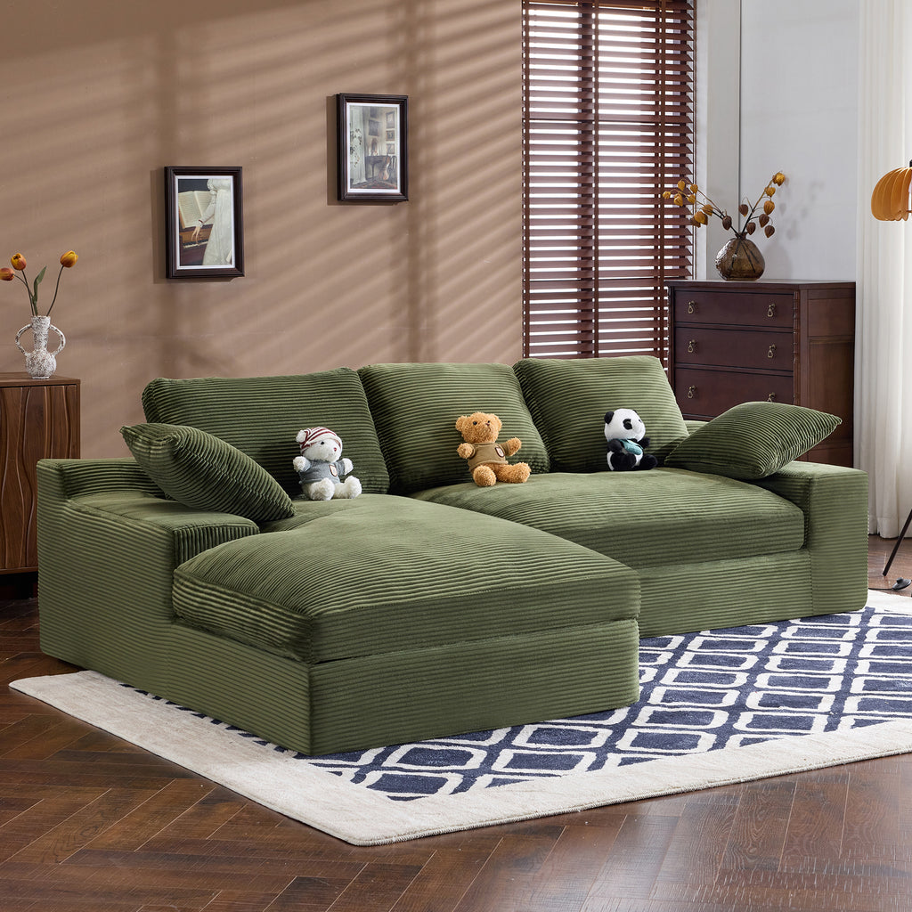 Side view of green corduroy sofa with plush pillows and soft cushions. Stylish and cozy seating for modern homes.