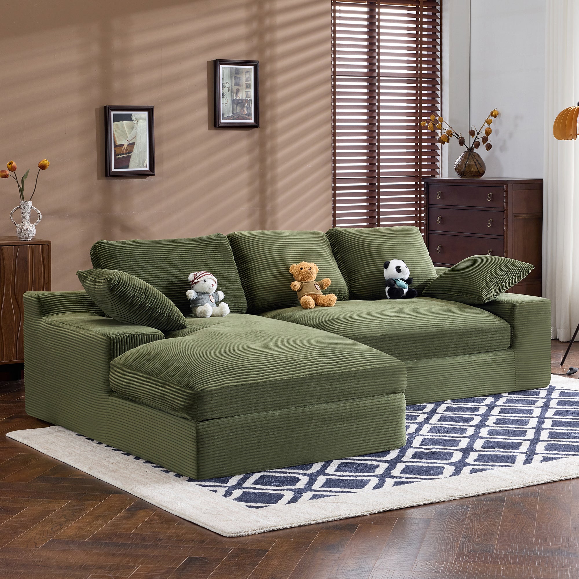 Side view of green corduroy sofa with plush pillows and soft cushions. Stylish and cozy seating for modern homes.