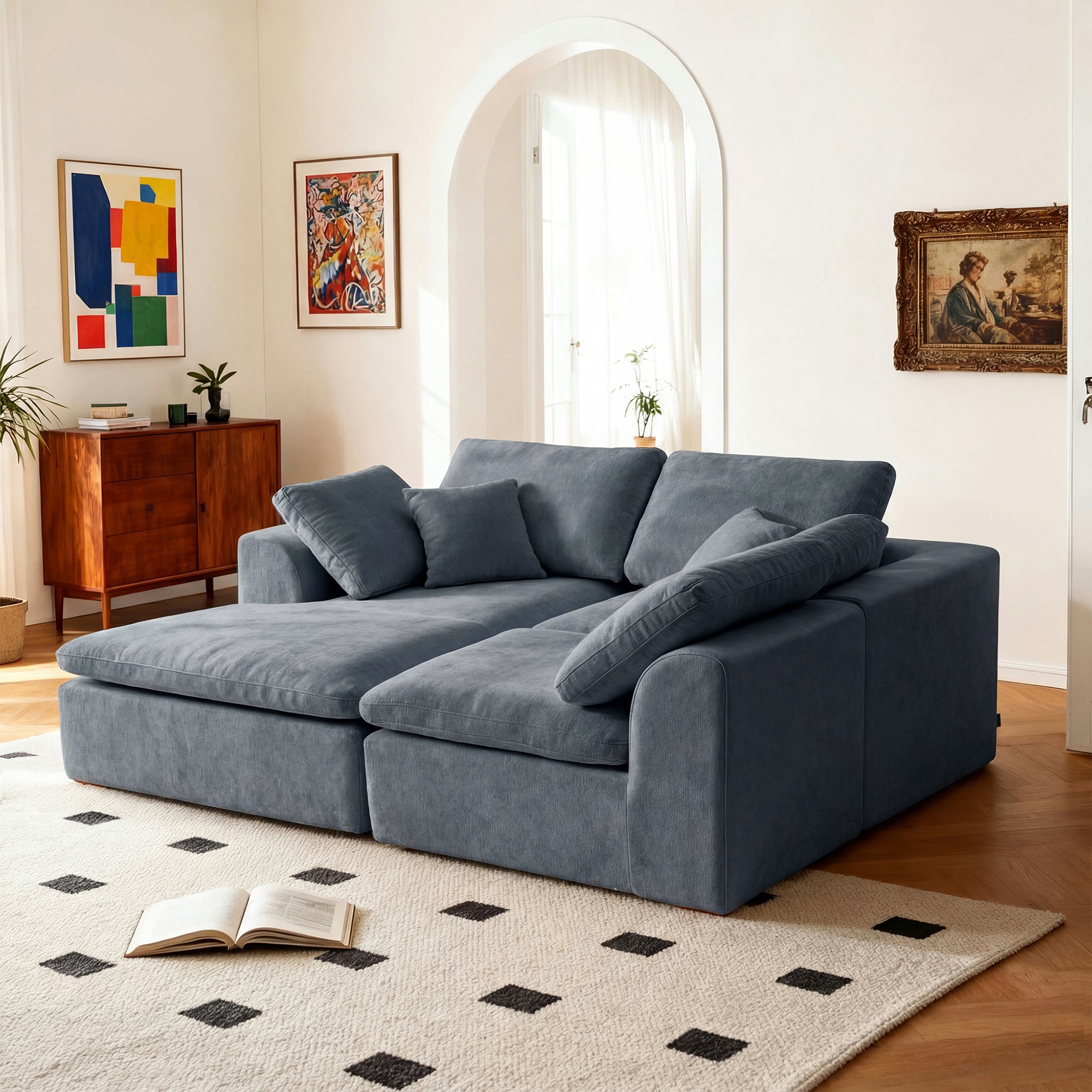 Modern L-shaped sectional sofa with chaise in a wide configuration, featuring deep seats and soft chenille upholstery.