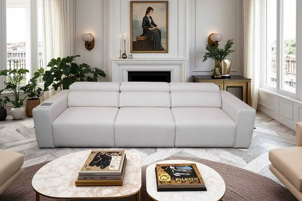 Light grey 3-seat modular power reclining sofa with integrated wireless charging and speakers in a modern living room.