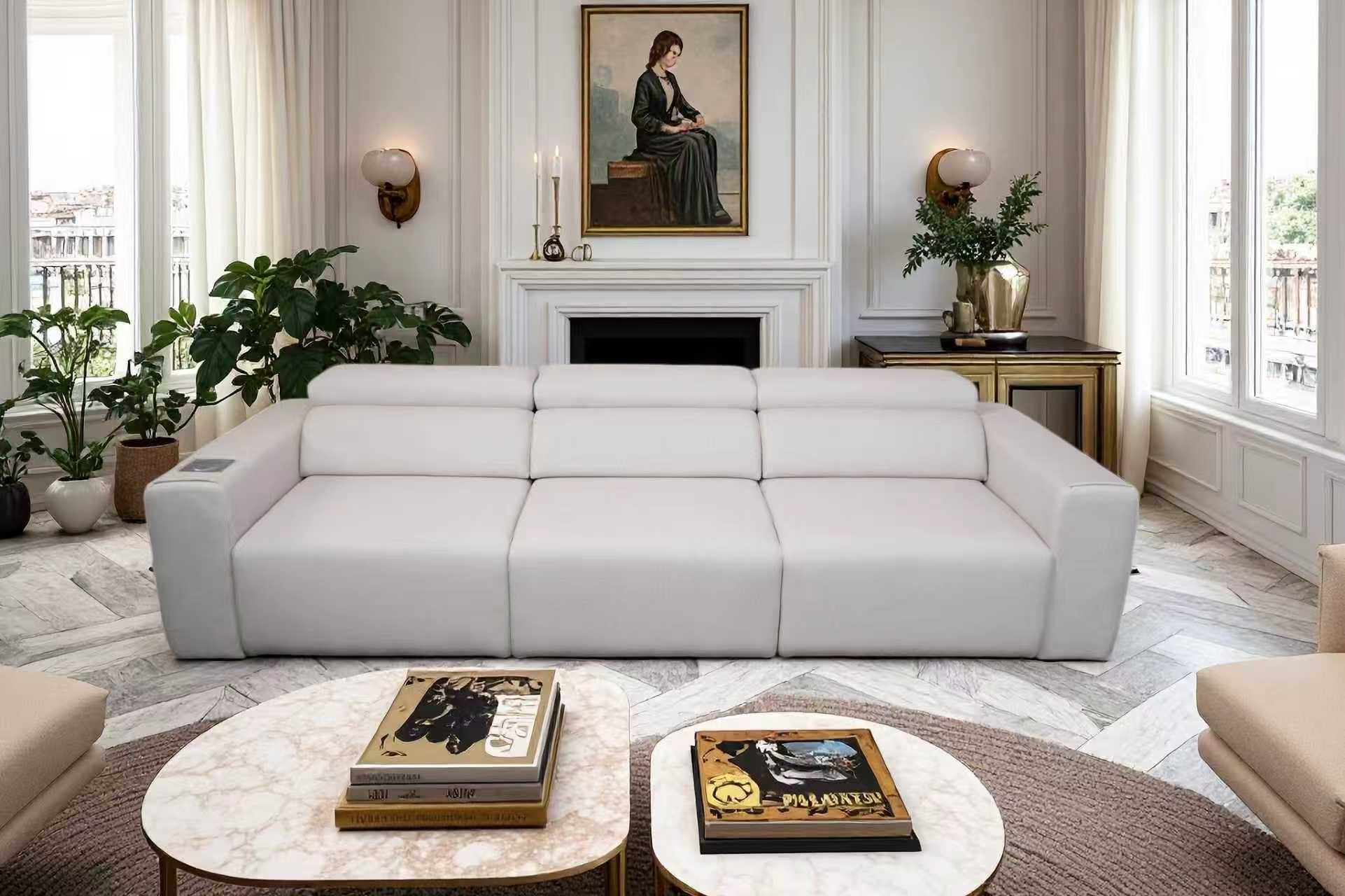 Light grey 3-seat modular power reclining sofa with integrated wireless charging and speakers in a modern living room.