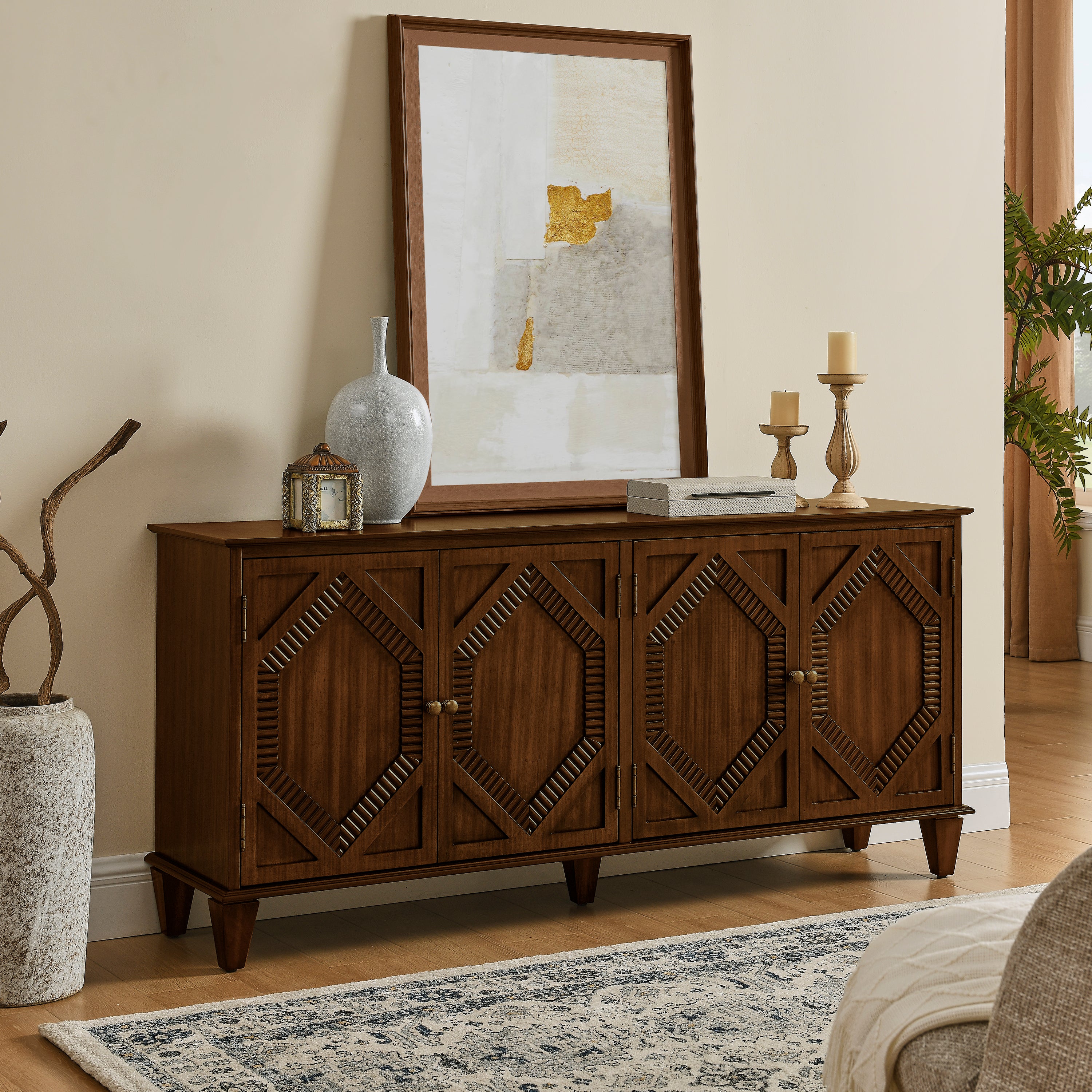 Mid-century walnut sideboard featuring four cabinet doors with symmetrical geometric carvings and tapered legs.