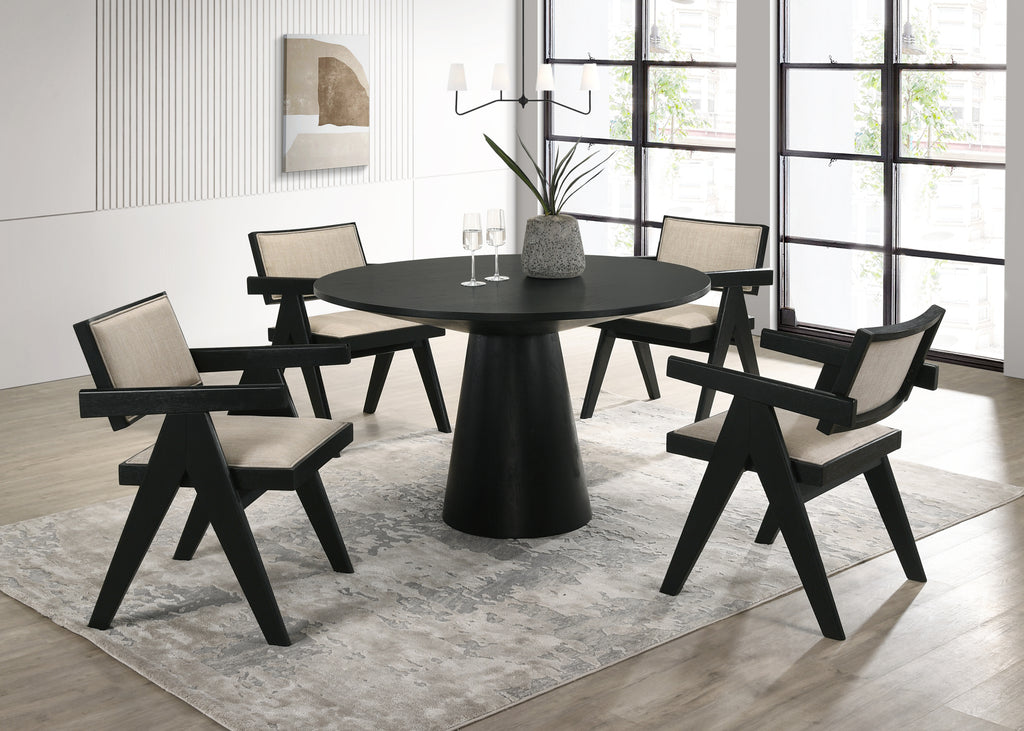 Jasper Dining Set - 5-Piece Ebony Black with pedestal base and fabric chairs in modern dining room. Ideal for contemporary interiors.