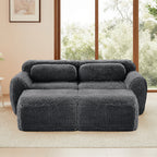 Front view of Plush Modular Sofa Dark Grey with ergonomic pillows and ottoman, showcasing its deep seating and plush texture.