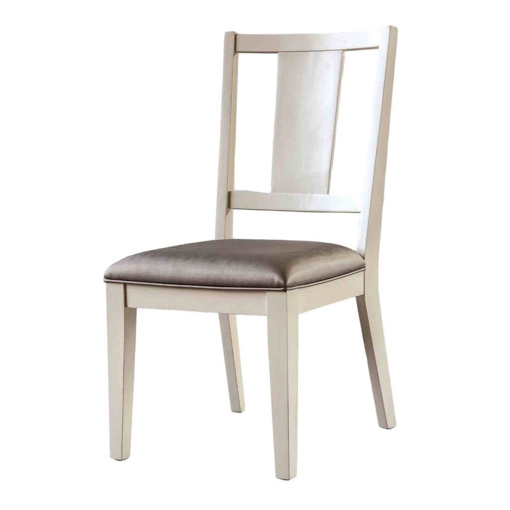 Padded seat dining chair in white oak finish with a faceted back design. Blends traditional and modern aesthetics for dining room use.