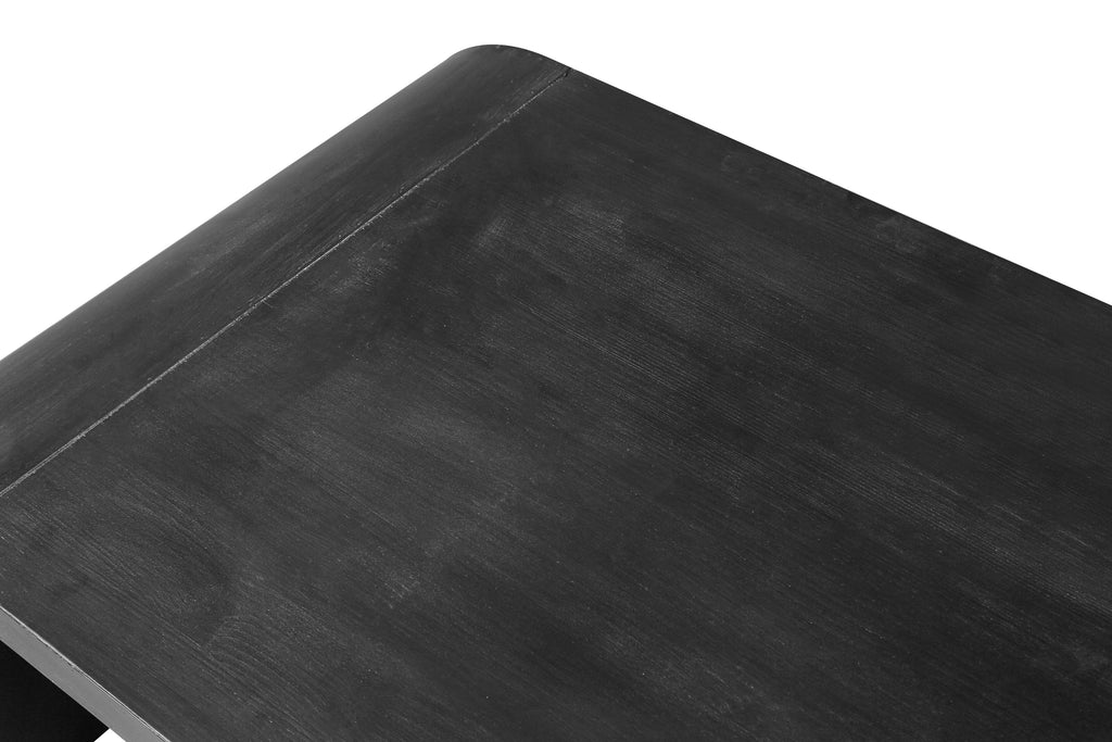 Close-up of the tabletop surface on the Farmhouse Crafts Coffee Table, highlighting the black wood grain and seamless curved edge.