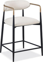 Angled view of a contemporary counter height chair featuring black metal legs, gold arm detailing, and a soft beige upholstered seat.