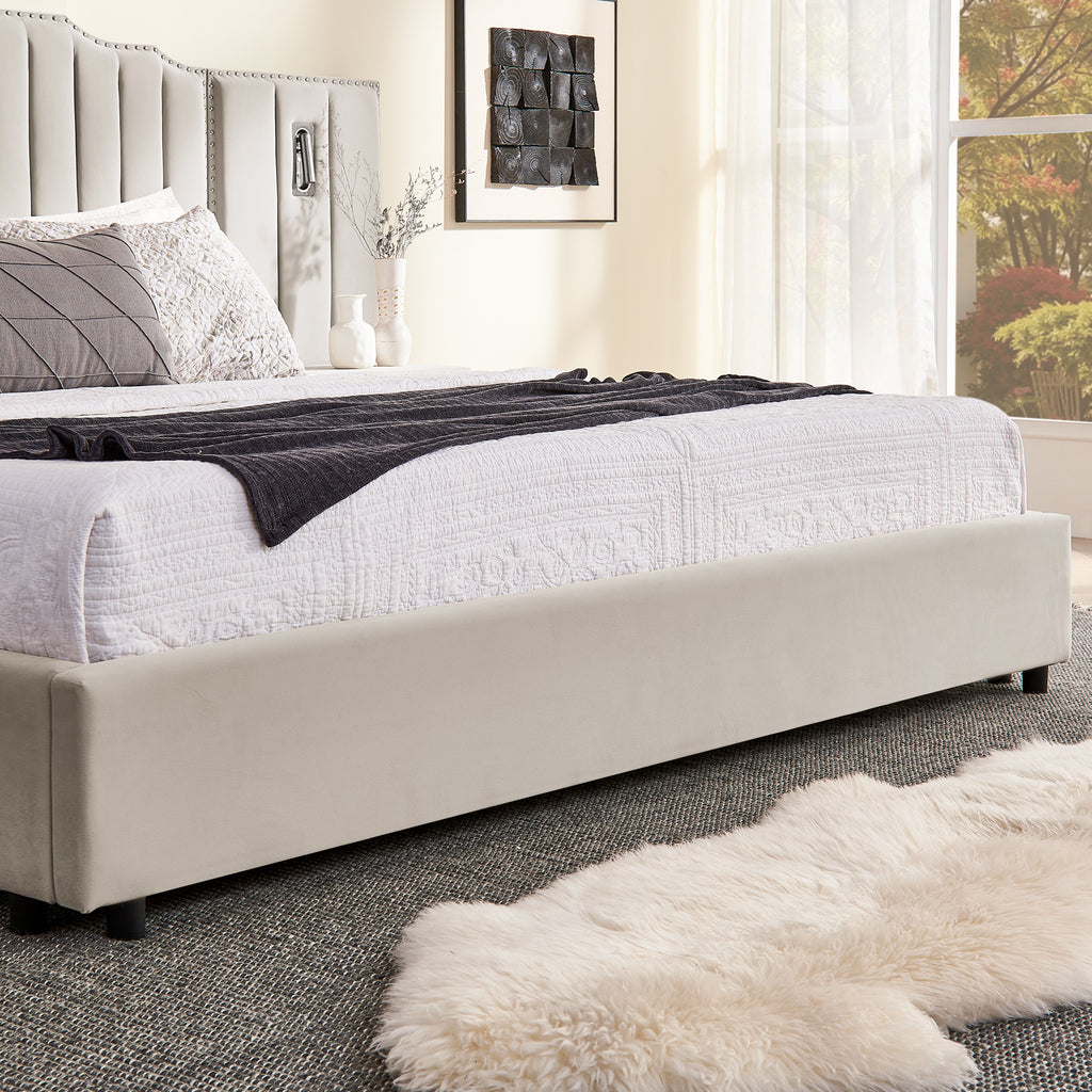 Lower corner of king bed frame showing upholstered base and soft bedding, highlighting no box spring design and solid construction.