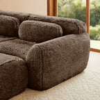 Detail of armrest and cushion on 114'' chocolate modular sofa, emphasizing plush texture and ergonomic design.