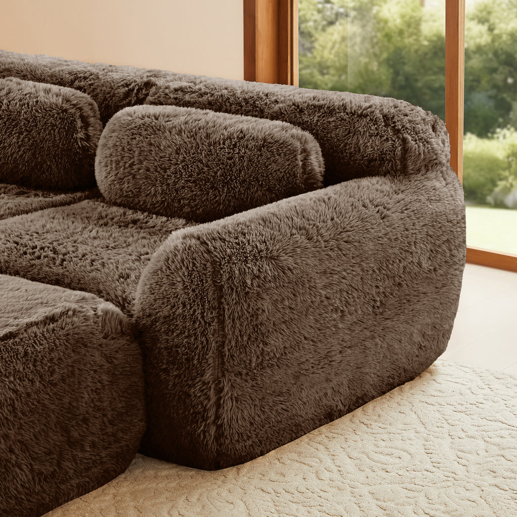 Detail of armrest and cushion on chocolate modular sofa 3-seater plush fabric, emphasizing its thick, soft texture.