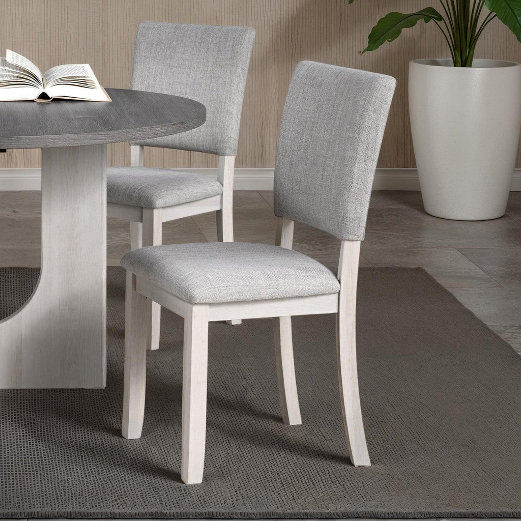 5pc dining set with gray upholstered chairs and round table.