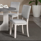 5pc dining set with gray upholstered chairs and round table.