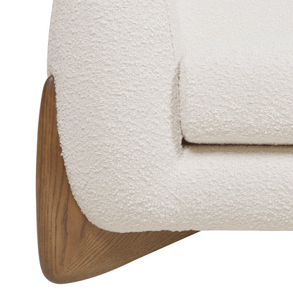 Close-up of Alpine 44' Sherpa Arm Chair's armrest and oak leg, highlighting boucle texture and wood grain.