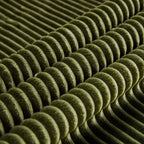 Close-up of green corduroy fabric texture with ribbed pattern. Soft, skin-friendly material ideal for comfortable seating.