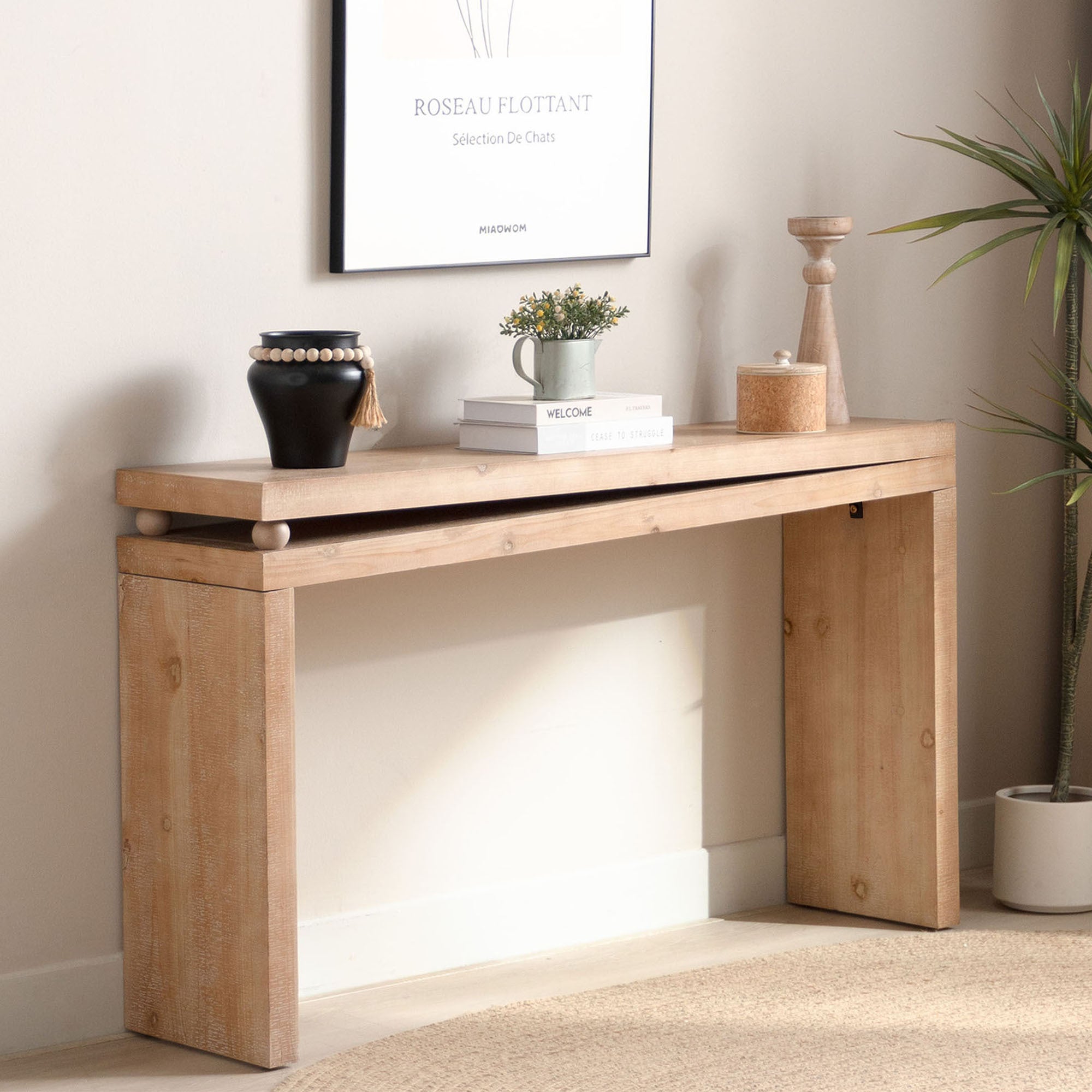 Modern farmhouse console table in natural wood finish, styled in a hallway setting with decorative accents and bead detail.