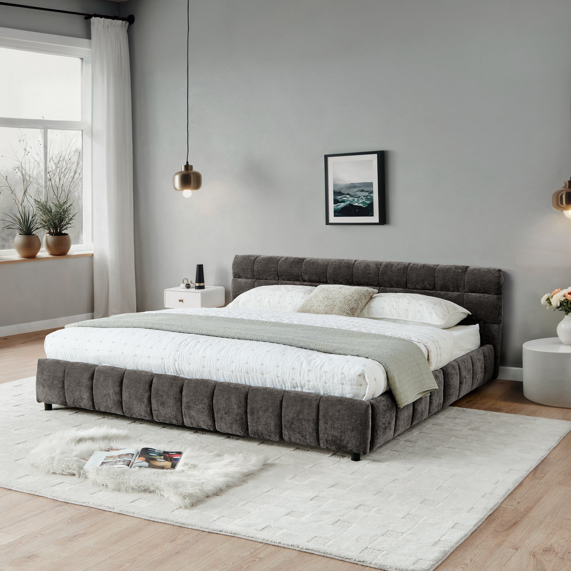 California King upholstered bed in dark gray with closed storage drawers, placed in a minimalist bedroom with soft lighting and neutral tones.
