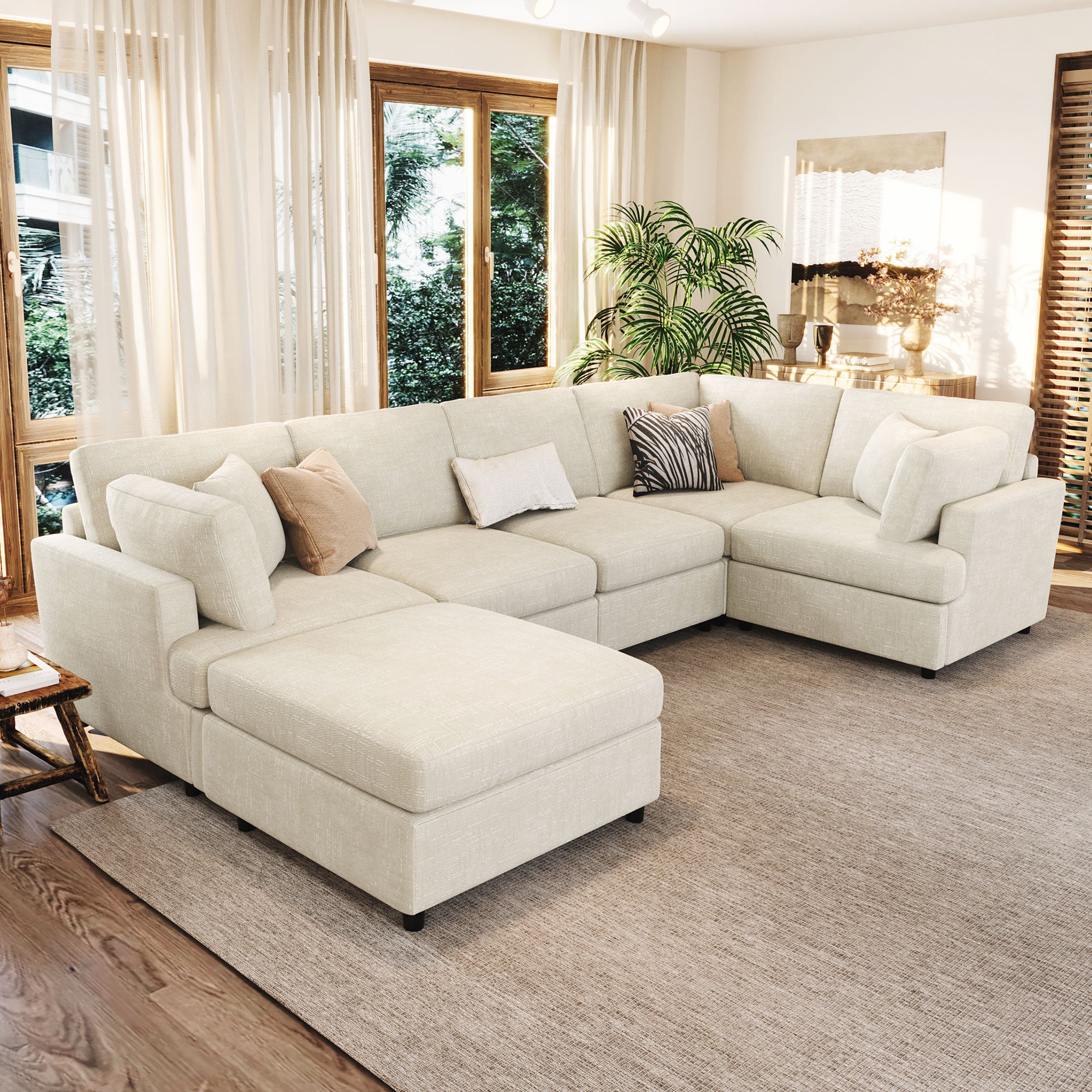 U-shaped sectional sofa with ottoman in cream chenille fabric, perfect for large living rooms with modular seating and plush cushions.