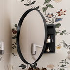 Round Black Metal Medicine Cabinet with Mirror mounted on floral bathroom wall, featuring side storage shelves for toiletries.
