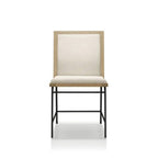 Front view of Oak Beige Dining Chair with cushioned seat and backrest, framed in wood and supported by sleek black metal legs.