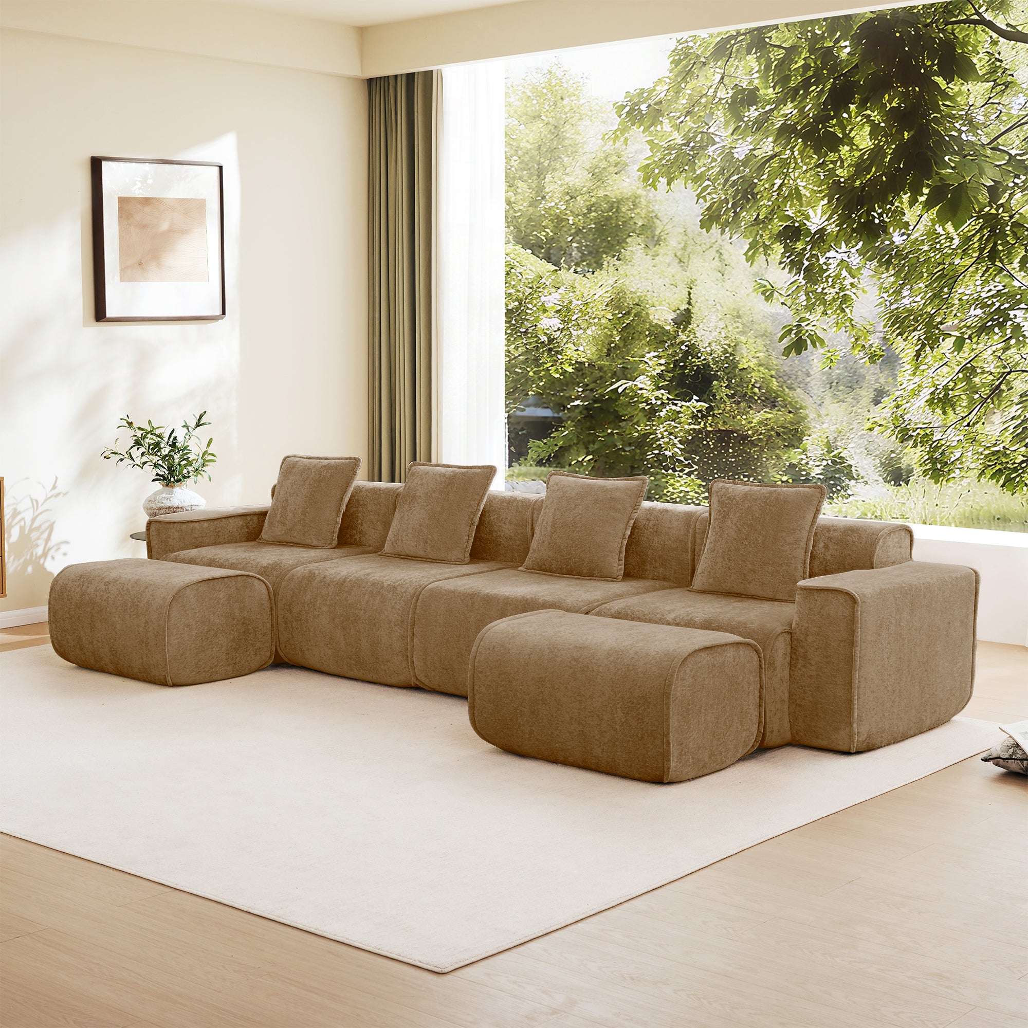 Angled view of Modular U Shape Sectional Sofa - Velvet, Brown | 4-Seat featuring two ottomans and soft velvet texture in a sunlit room.