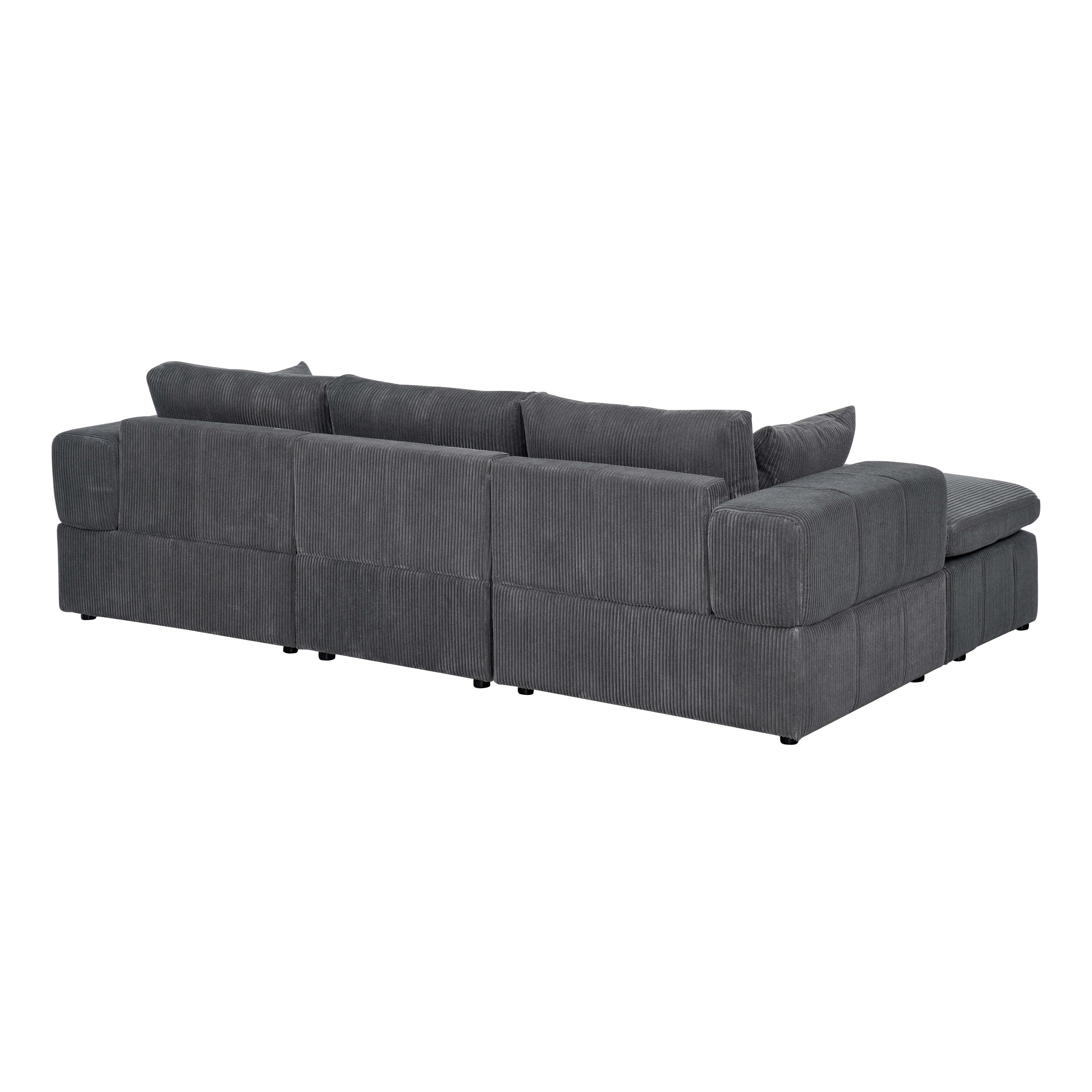 Rear view of large modular sectional in dark gray corduroy. Displays clean lines and modular back panel construction.