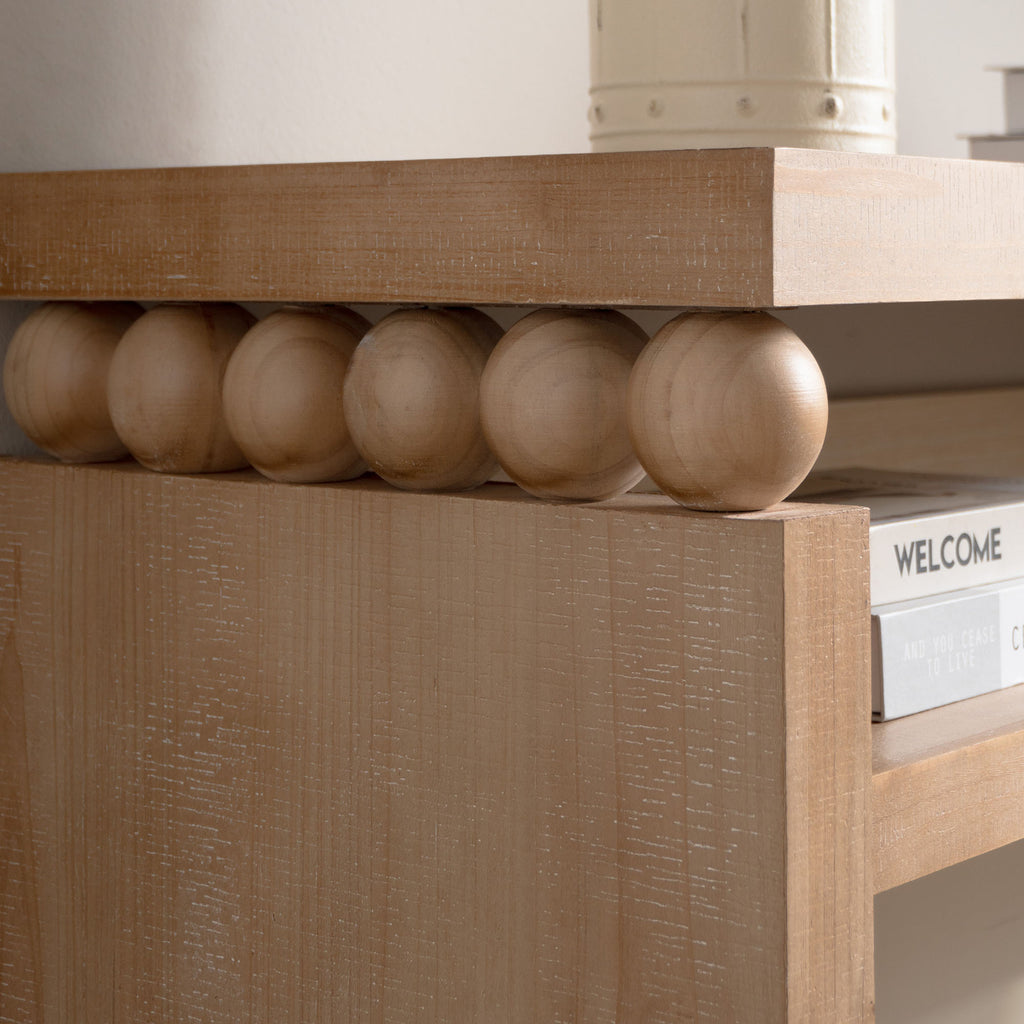 Side view of rustic console table with shelf, focusing on the rounded bead detail and natural wood finish.