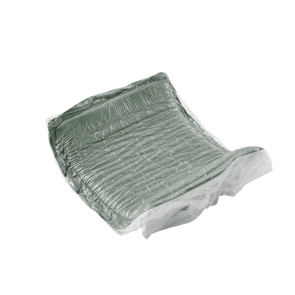Vacuum-sealed green velvet cushion from the Modular Velvet Sofa, illustrating compact packaging for no-assembly setup.