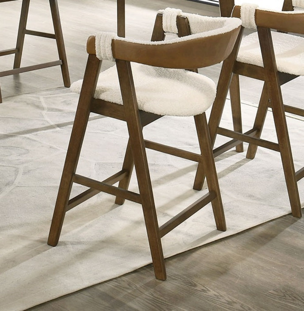 Set of Mid-Century Modern Counter Stools with walnut wood legs and beige cushioned seats, enhancing contemporary dining spaces.