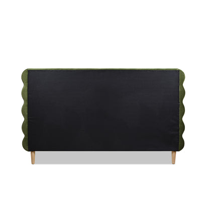 Back view of the Stockholm Modern king bed's wavy headboard in olive green velvet with black fabric panel and wood legs.