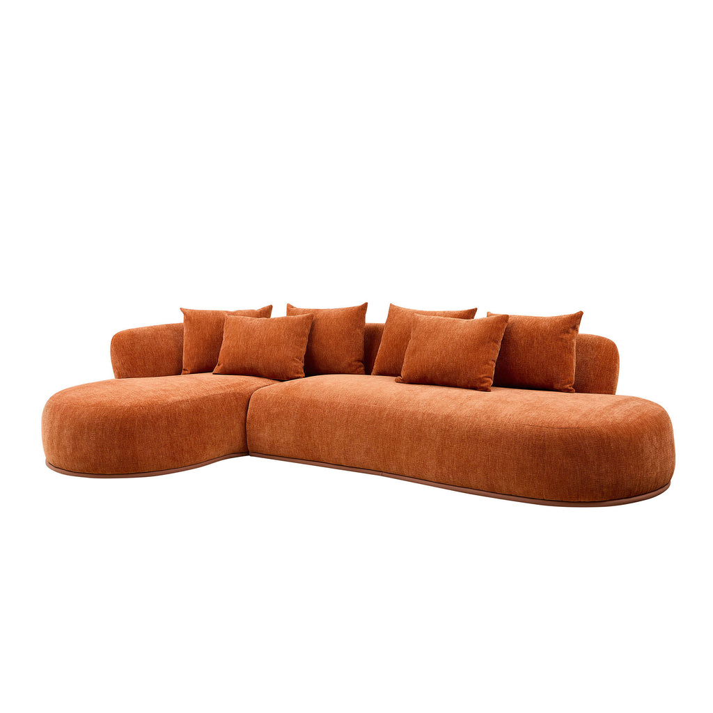 Angled view of modern L-shape sectional sofa with deep seat and chaise, featuring plush burnt orange upholstery and oversized comfort.
