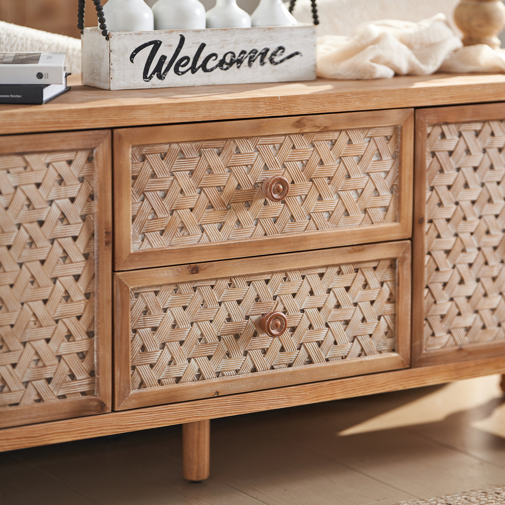 Front view of the Rattan TV Stand Mid Century with Storage, featuring boho-style drawers and doors with wooden knobs.