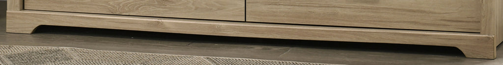 Base detail of Elara Light Oak 6-Drawer Dresser with subtle curved skirting for a refined modern look.