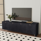 70'-90' extendable black media console with modern textured finish, supporting a flat-screen TV and decorative vase in a stylish interior.