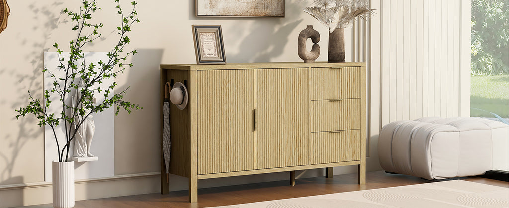 Wave-pattern sideboard cabinet in a bright room with decorative items on top, offering modern storage for entryways or living areas.