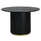 Modern black pedestal dining table with circular top and gold-accented base. Perfect for seating 4 in elegant dining areas.