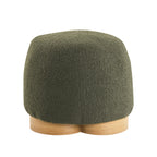 Round, olive green teddy fabric ottoman on a light wood circular base, featuring a modern, plush, minimalist design.