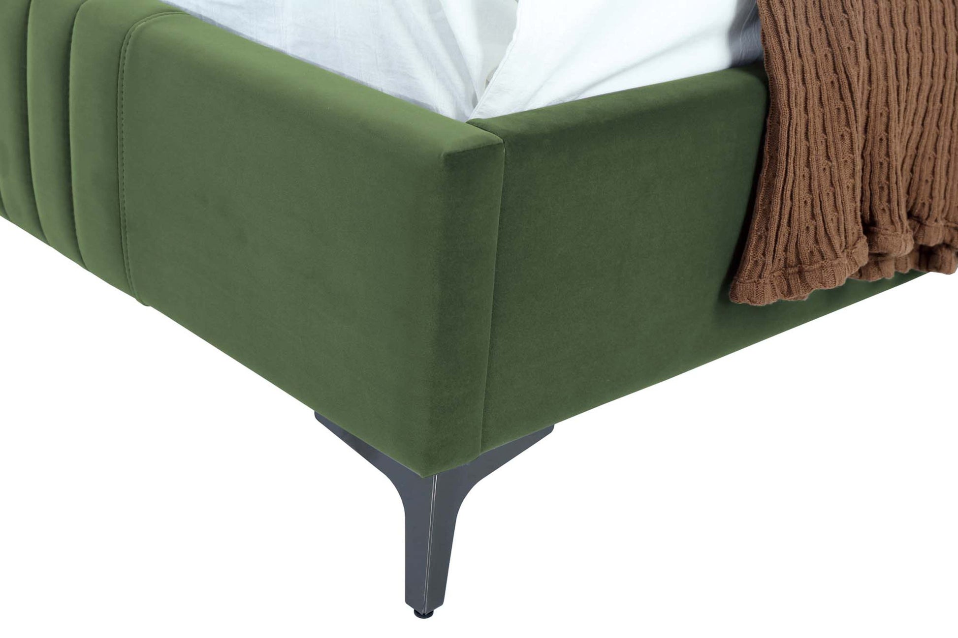 Detail of Moss Green 48' Velvet Bed corner with soft velvet upholstery and sleek black metal tapered leg.