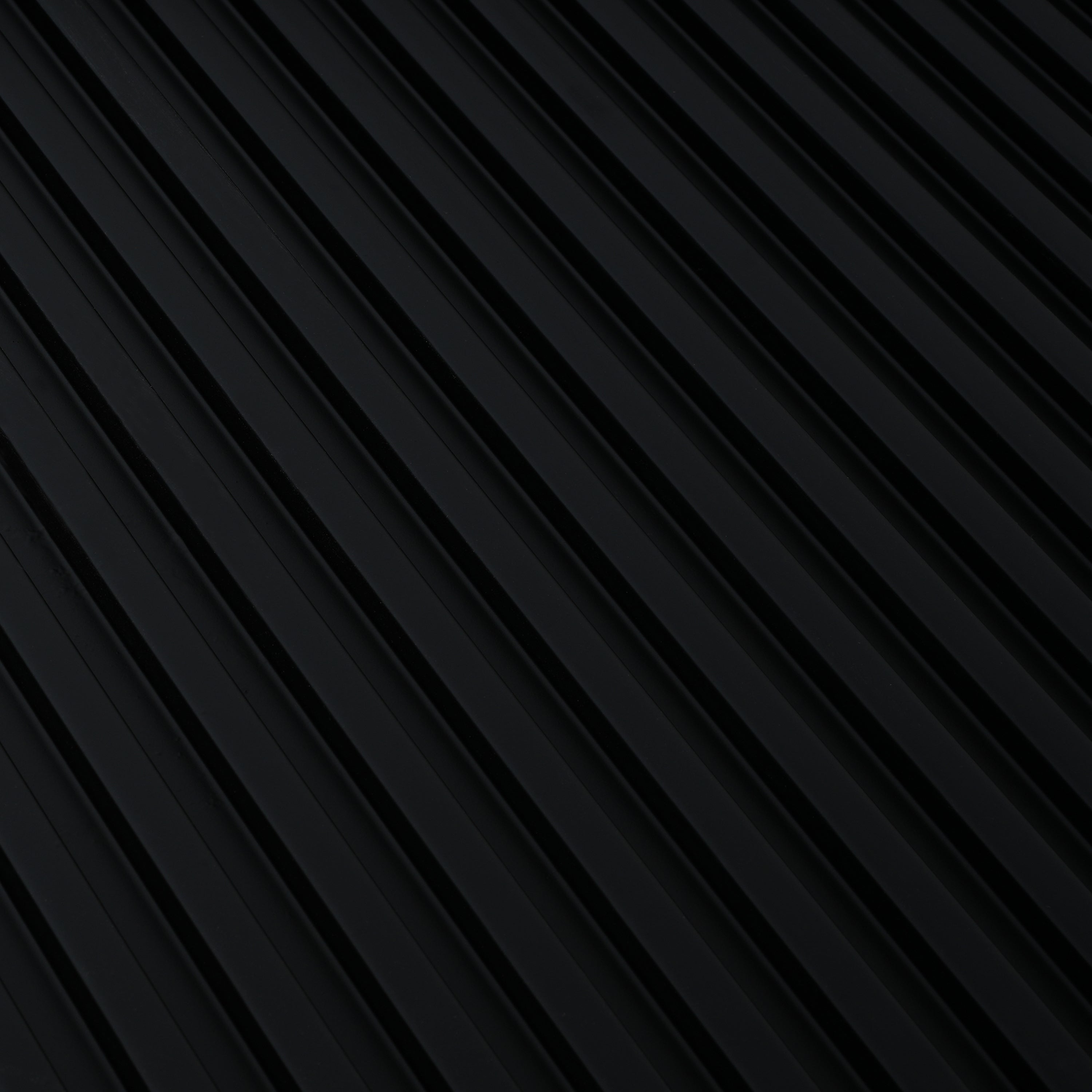 Close-up of the black fluted base texture on the modern counter table, highlighting its stylish vertical ridges.