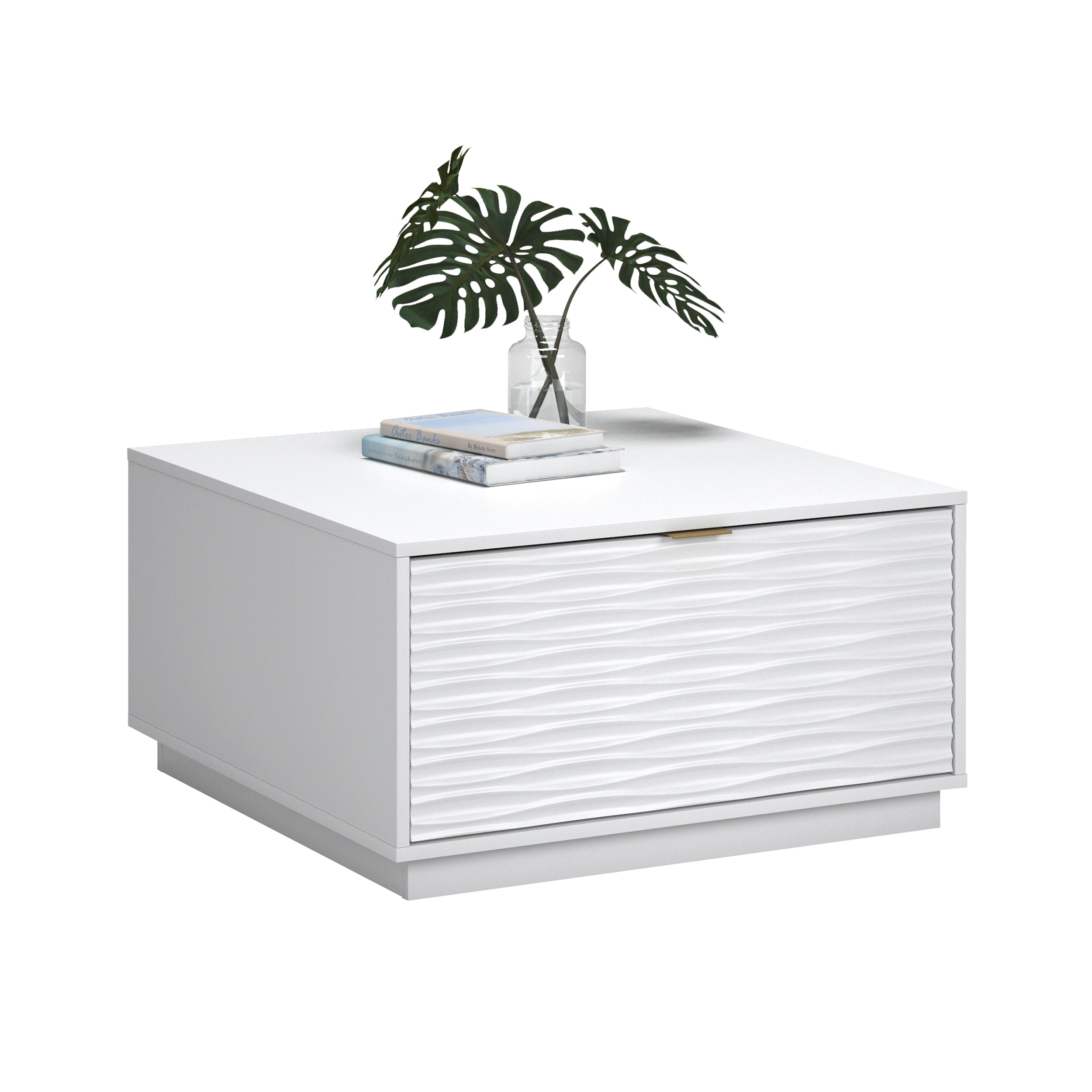 White coffee table with closed drawer and decorative items on top, featuring a coastal style with elegant gold-tone handle.