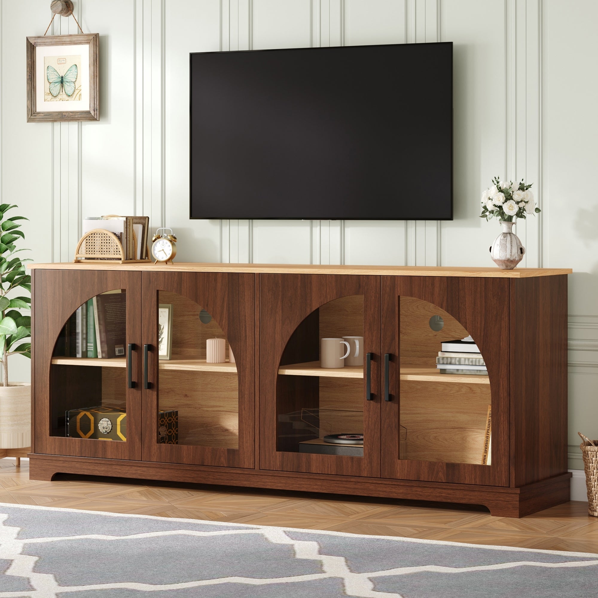 Two-tone walnut and natural wood farmhouse media console with four semi-arched glass doors and adjustable shelves.