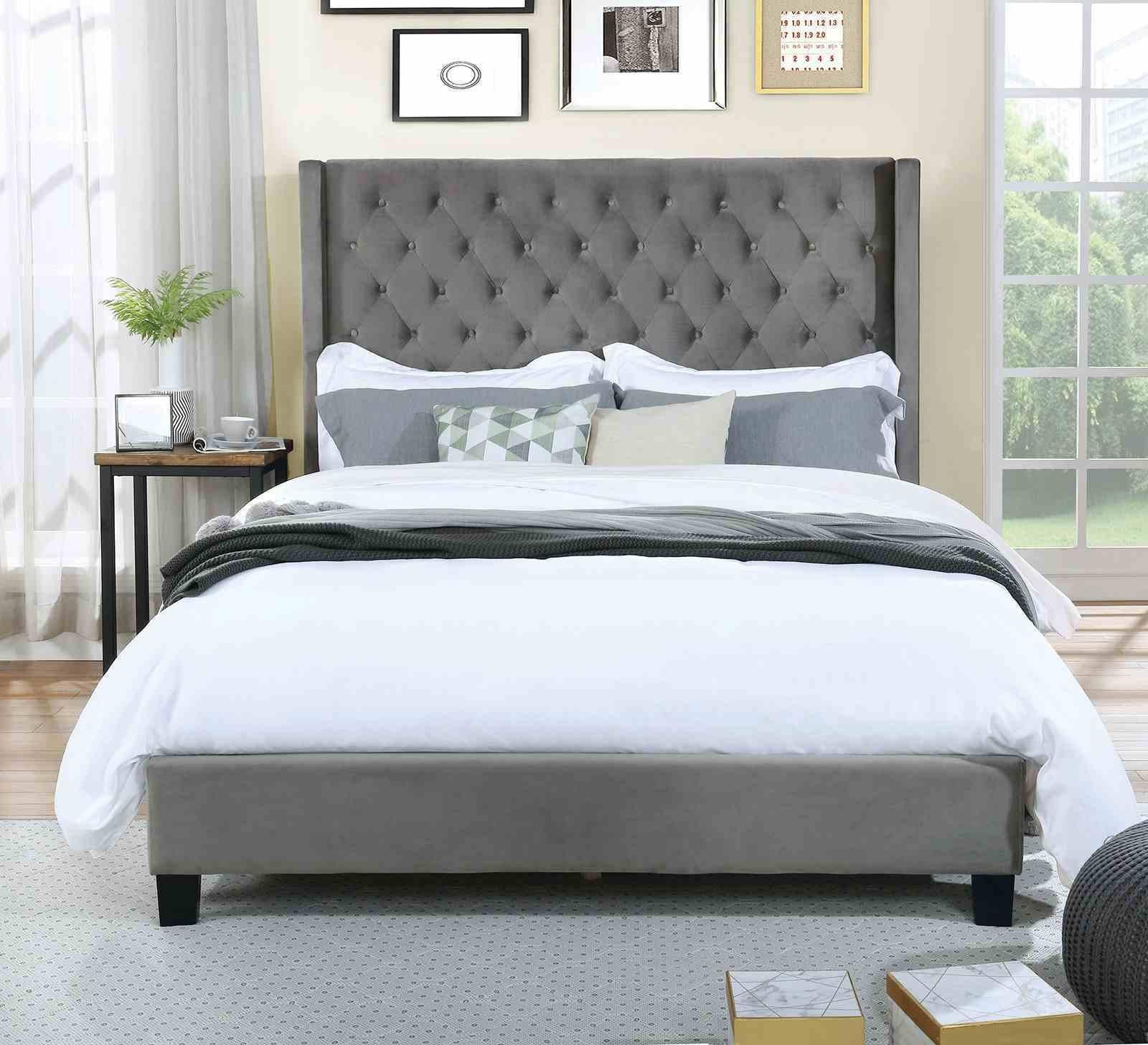 Gray Upholstered King Size Bed Frame with Wingback Design.