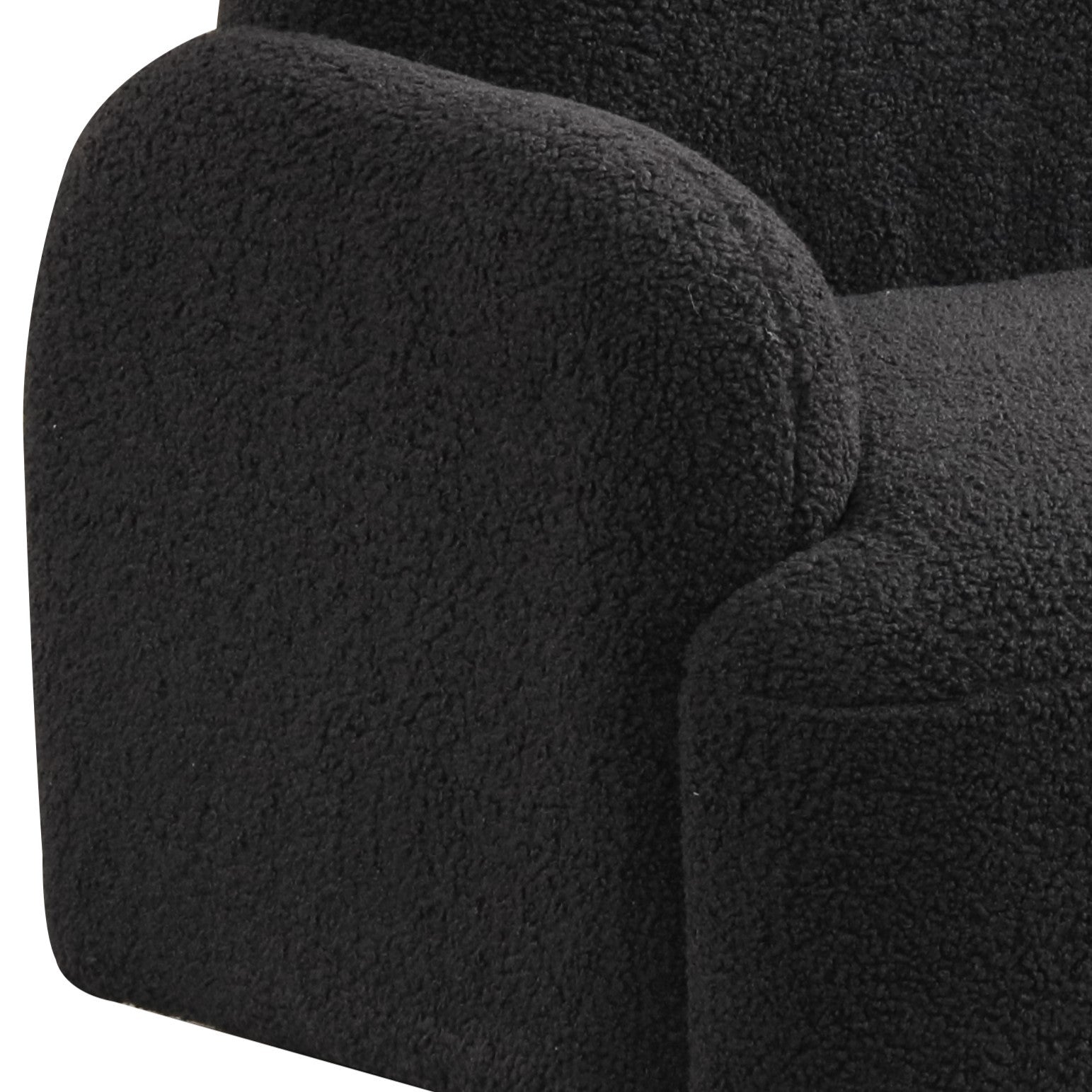 Armrest detail of Black Sherpa Kids Armchair featuring plush sherpa fabric and rounded design for a cozy, child-friendly seating option.