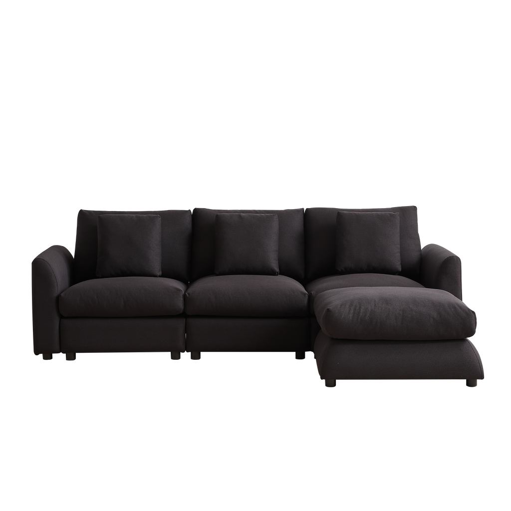 Full front view of modular L-shaped sofa with ottoman, showcasing 3 seat cushions and 4 pillows in a sleek, dark finish for versatile home decor.