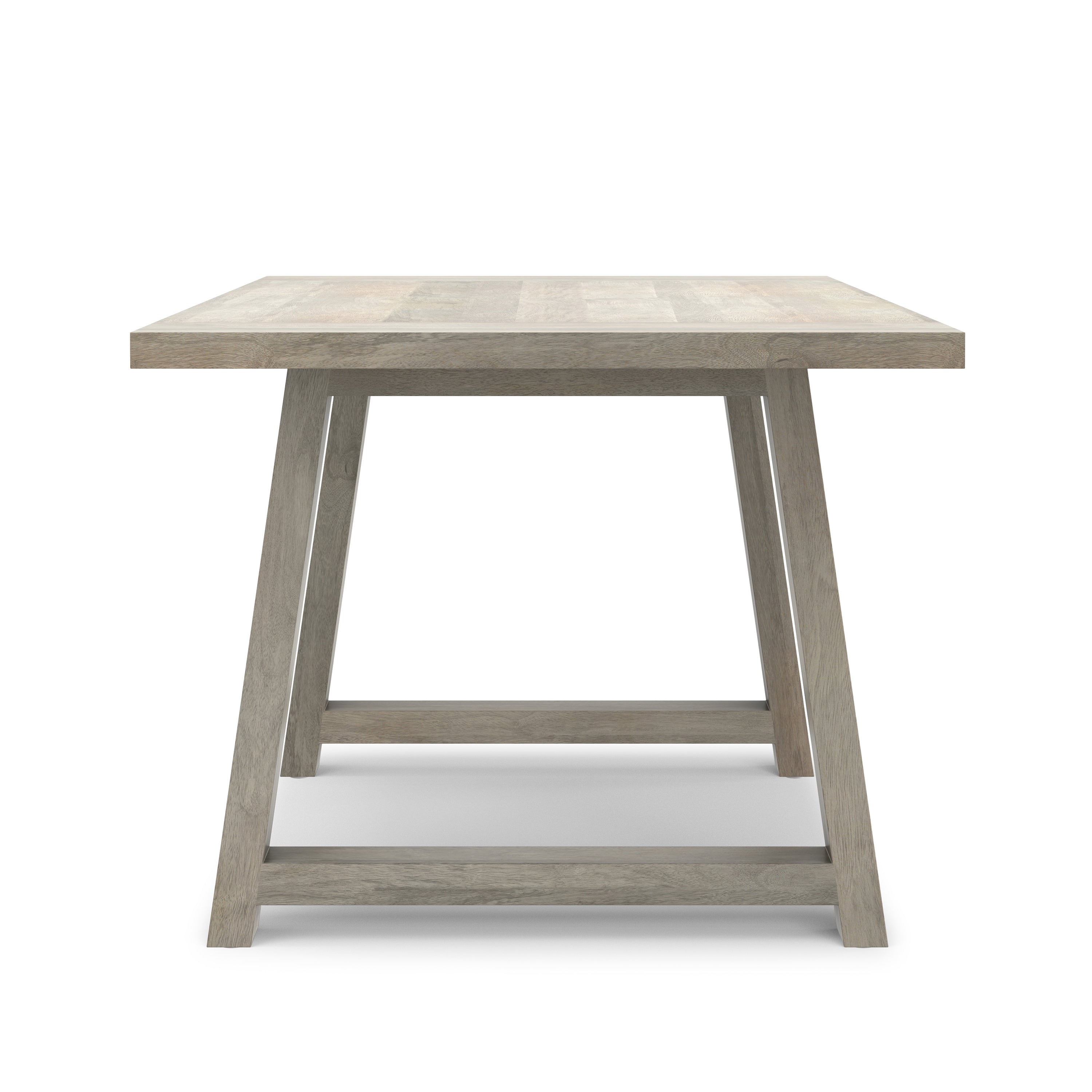 Side angle of the Whitley Dining Table in solid mango wood, emphasizing its thick tabletop and angled legs for stability.