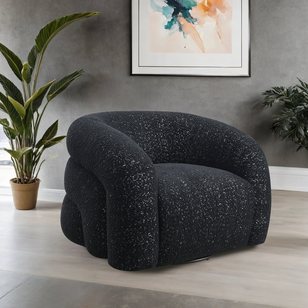 Black swivel chair with curved back and boucle fabric in modern living room. Features 360-degree rotation and high-density foam for comfort.