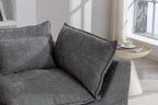 Close-up of the Cloud Couch backrest and armrest cushions in antique grey velvet, styled with a side table.